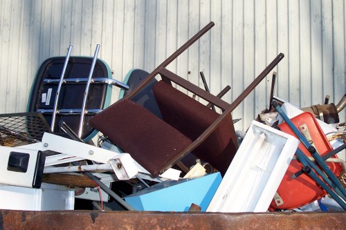 Front view of a commercial waste vehicle in an urban Chelmsford street